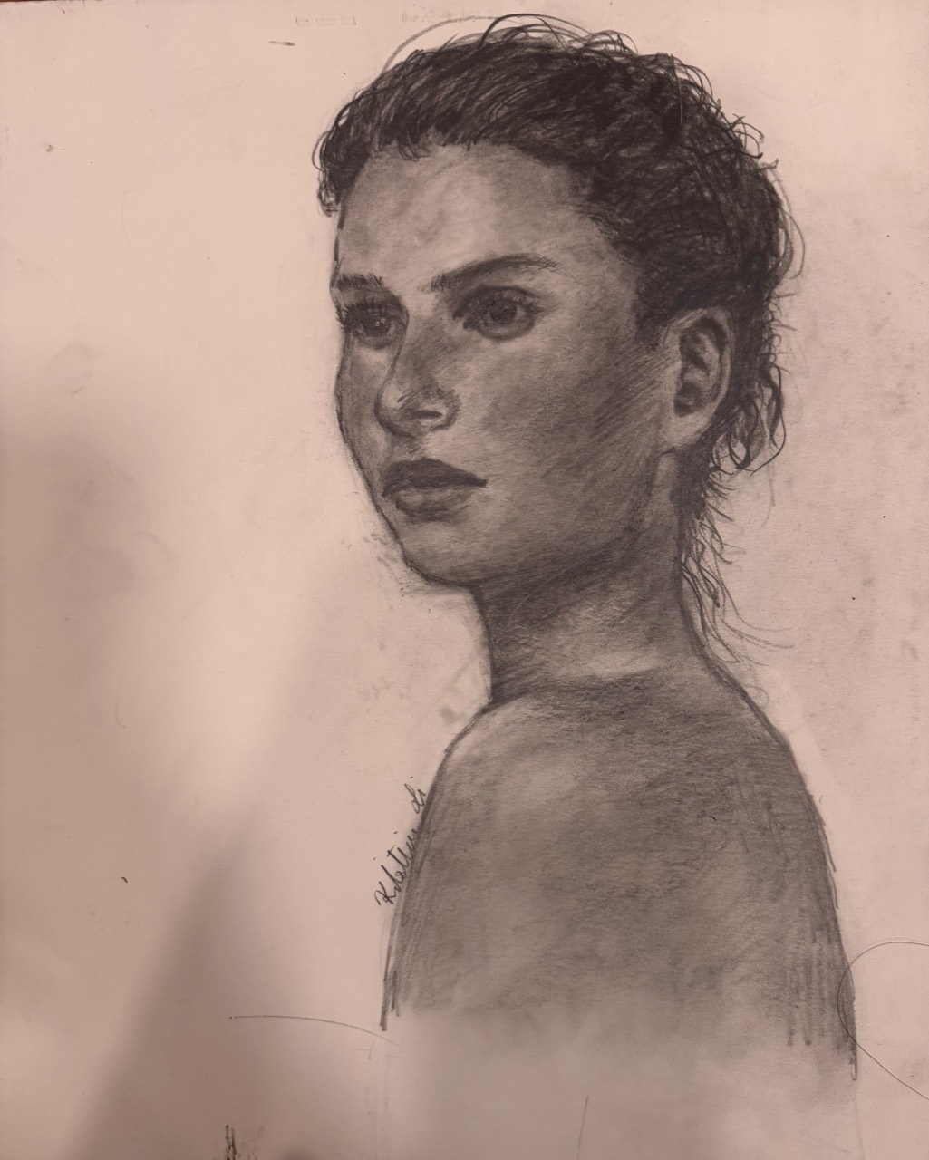 Graphite portrait of a woman in three-quarter view