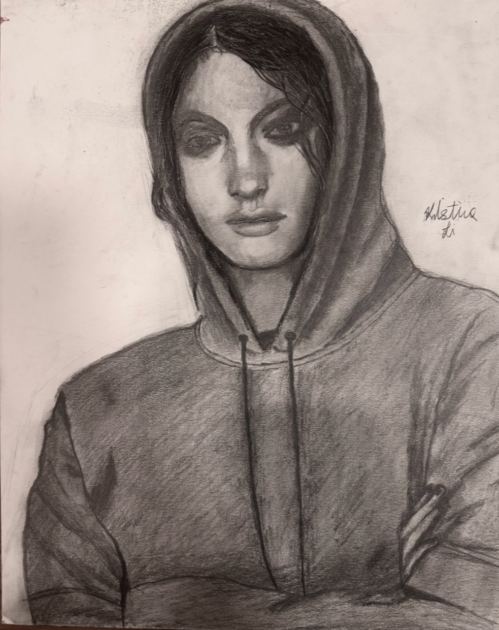 Graphite portrait of a person wearing a hooded sweatshirt