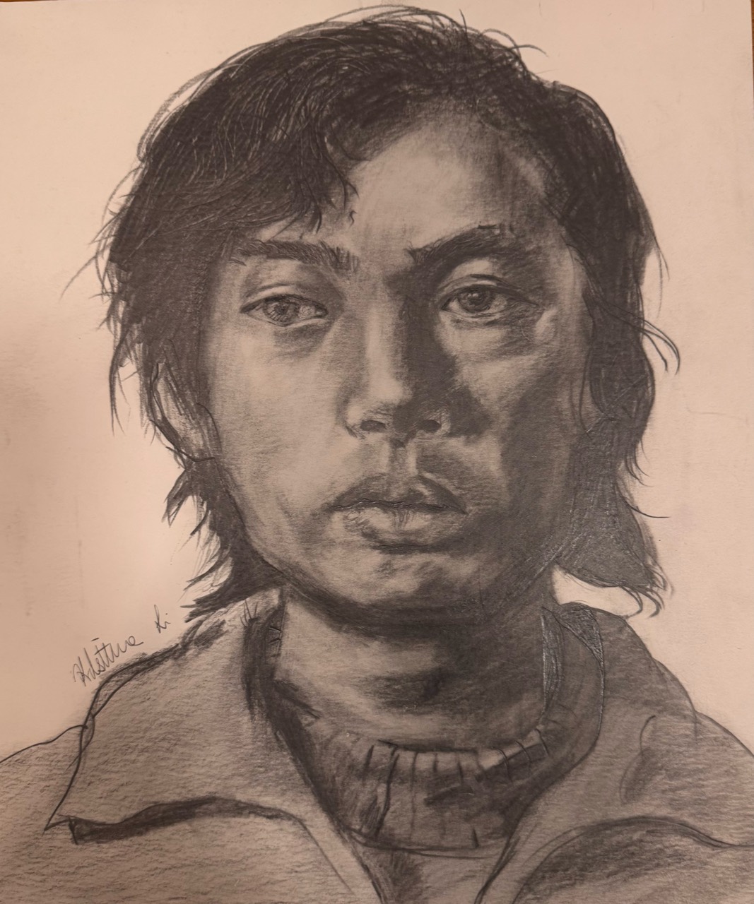 Graphite portrait of a person in a sweater and coat