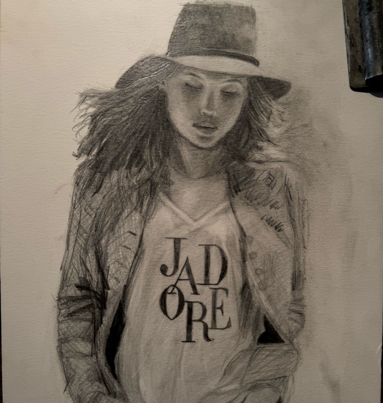 Graphite figure study of a woman wearing a brimmed hat