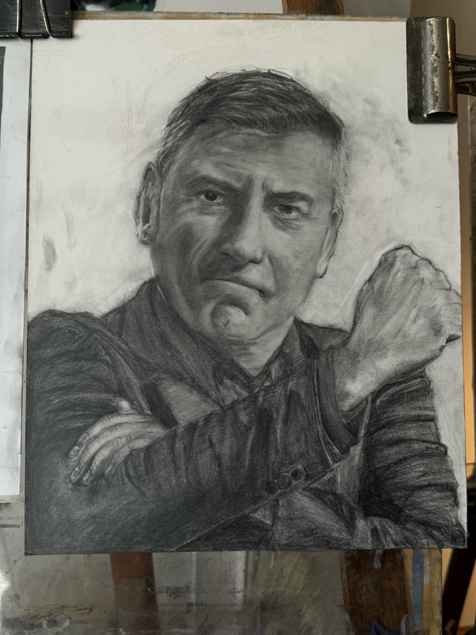 Graphite portrait of a man with crossed arms