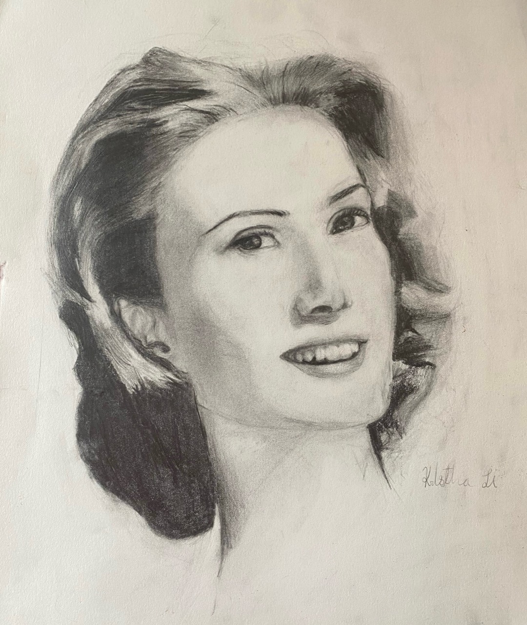 Graphite portrait of a smiling woman