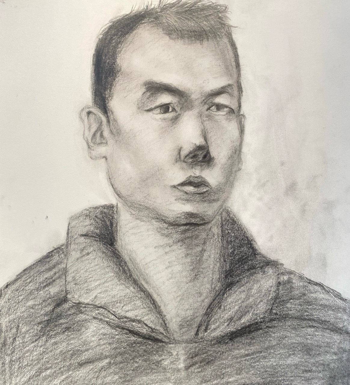 Graphite portrait of a man in a high-collared jacket