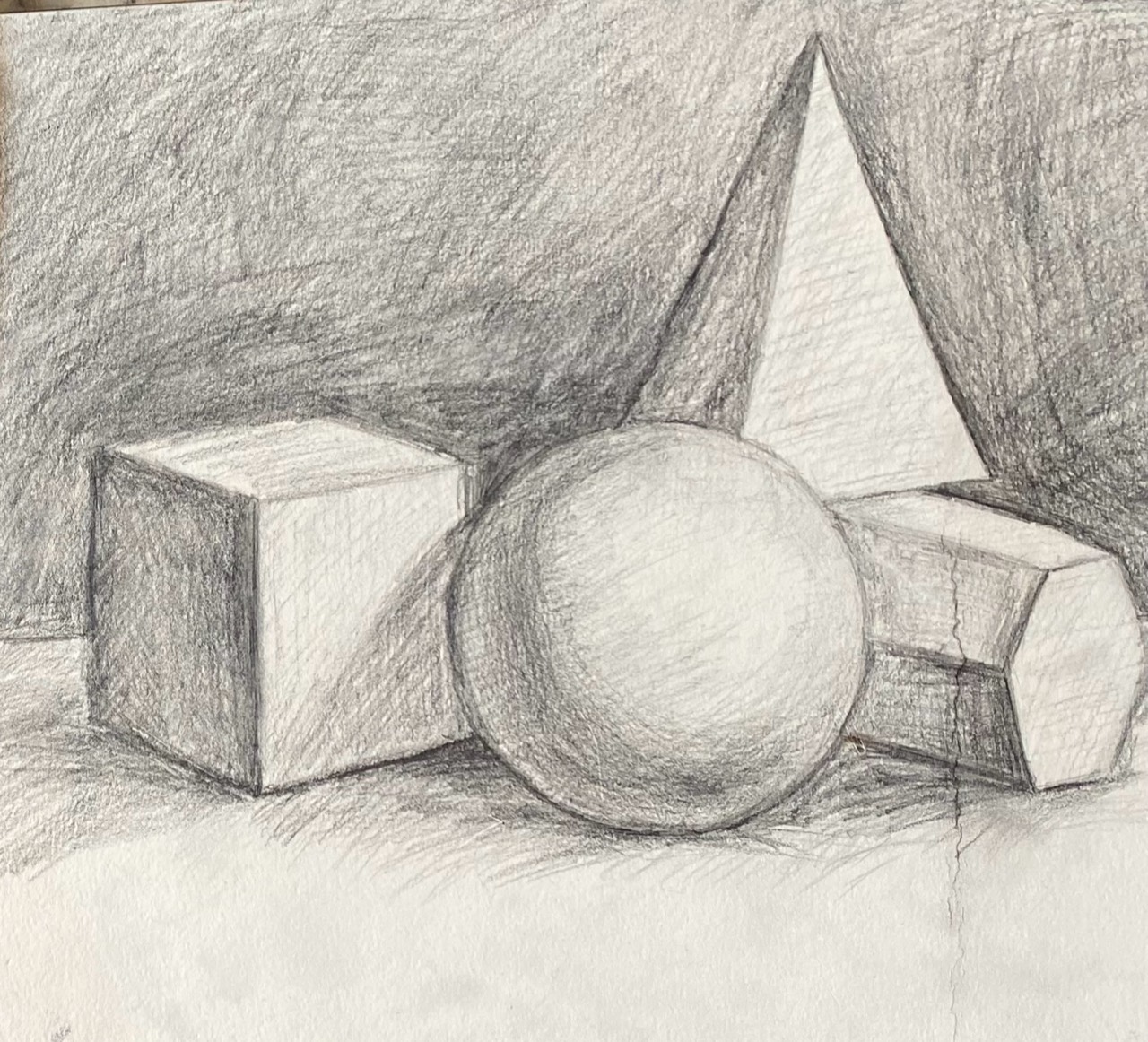 Graphite study of a cube, sphere, pyramid, and cylinder
